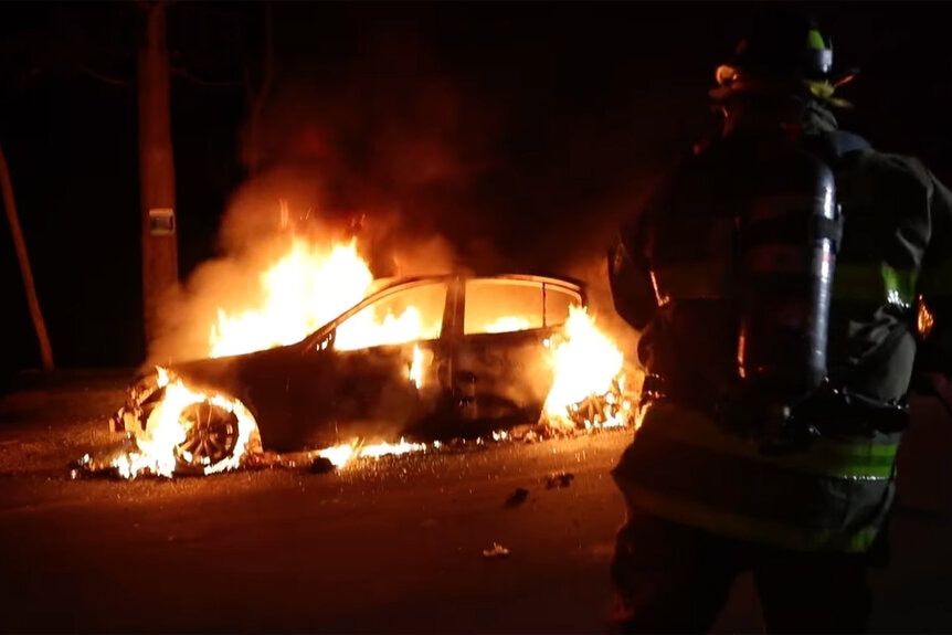 A photo of Carlos Reyes' Car on fire