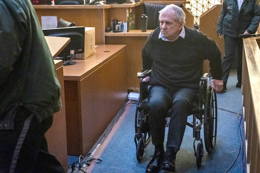 Robert Koehler, who authorities call the "Pillowcase Rapist," enters the courtroom in a wheelchair