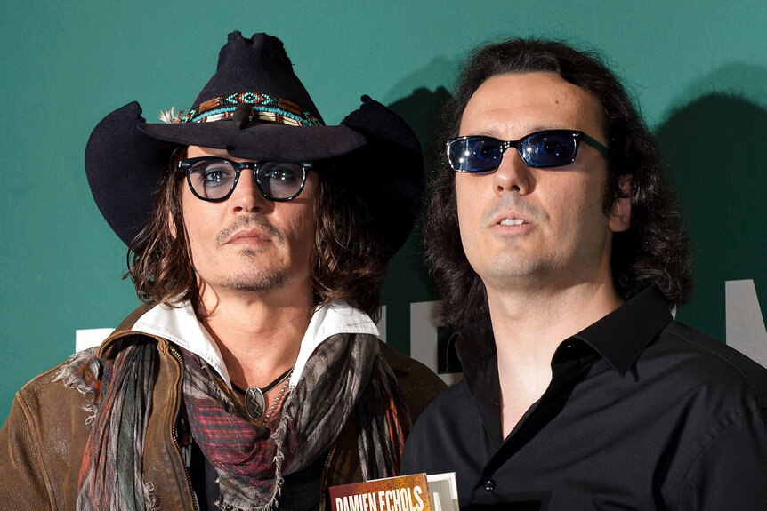 Johnny Depp (L) and Damien Echols