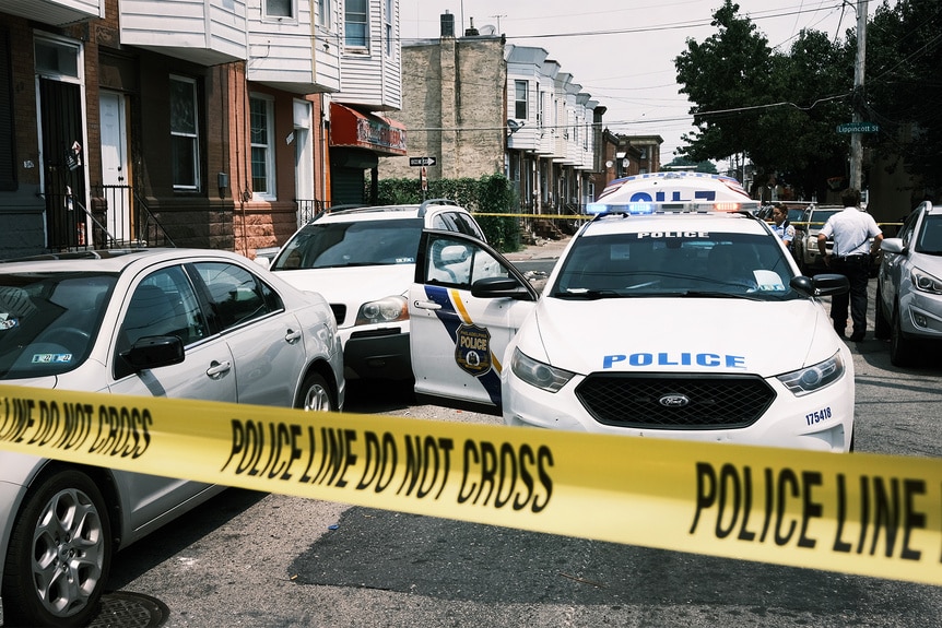 Philadelphia Police cars outside of a scene of a crime