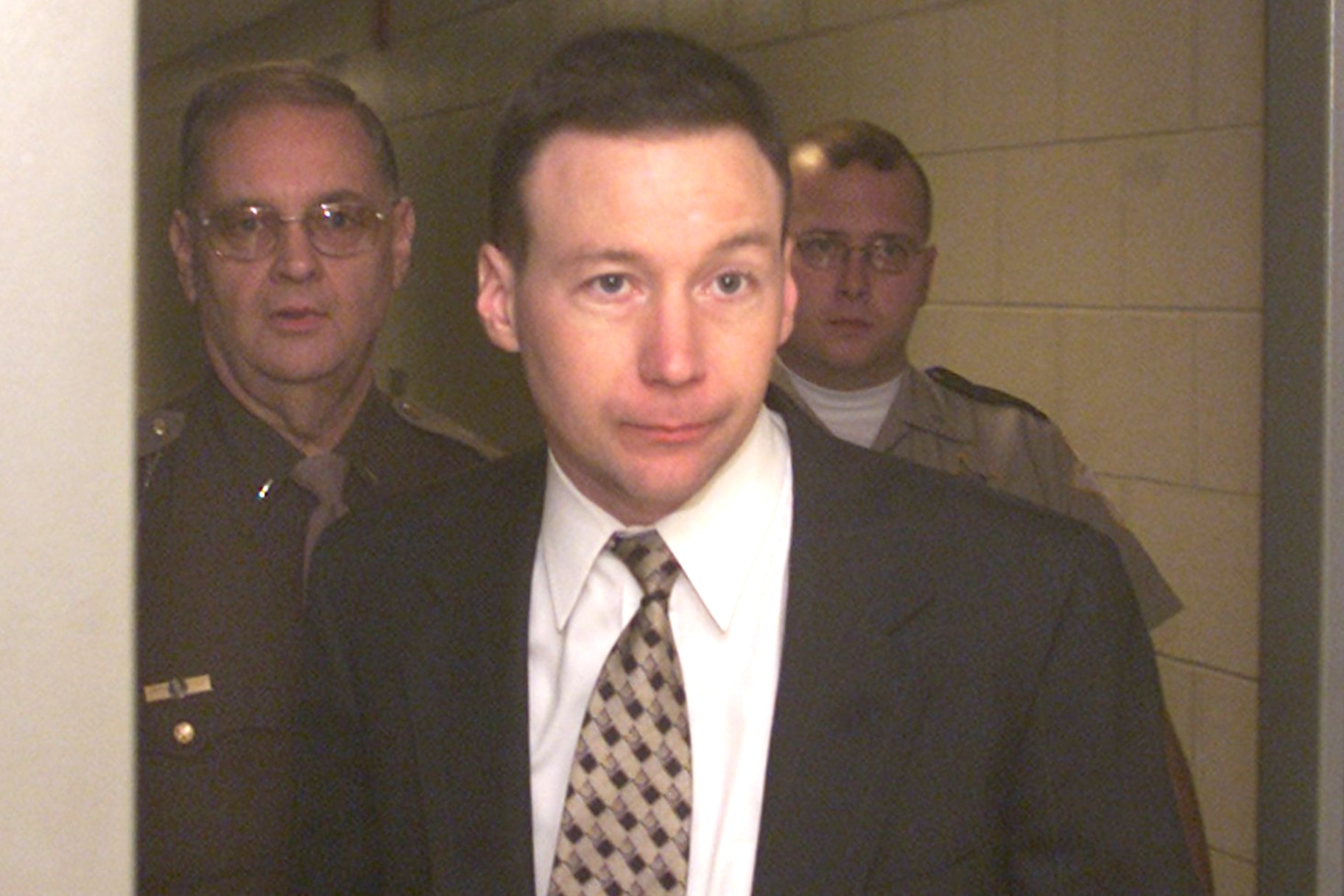 David Camm, is escorted from Floyd County jail to courtroom