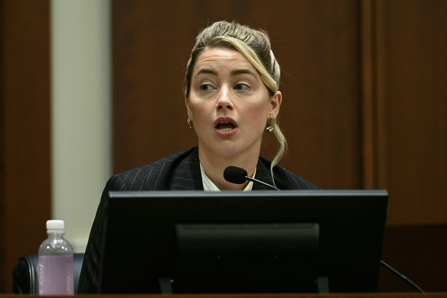 Amber Heard testifies in the courtroom on May 17, 2022