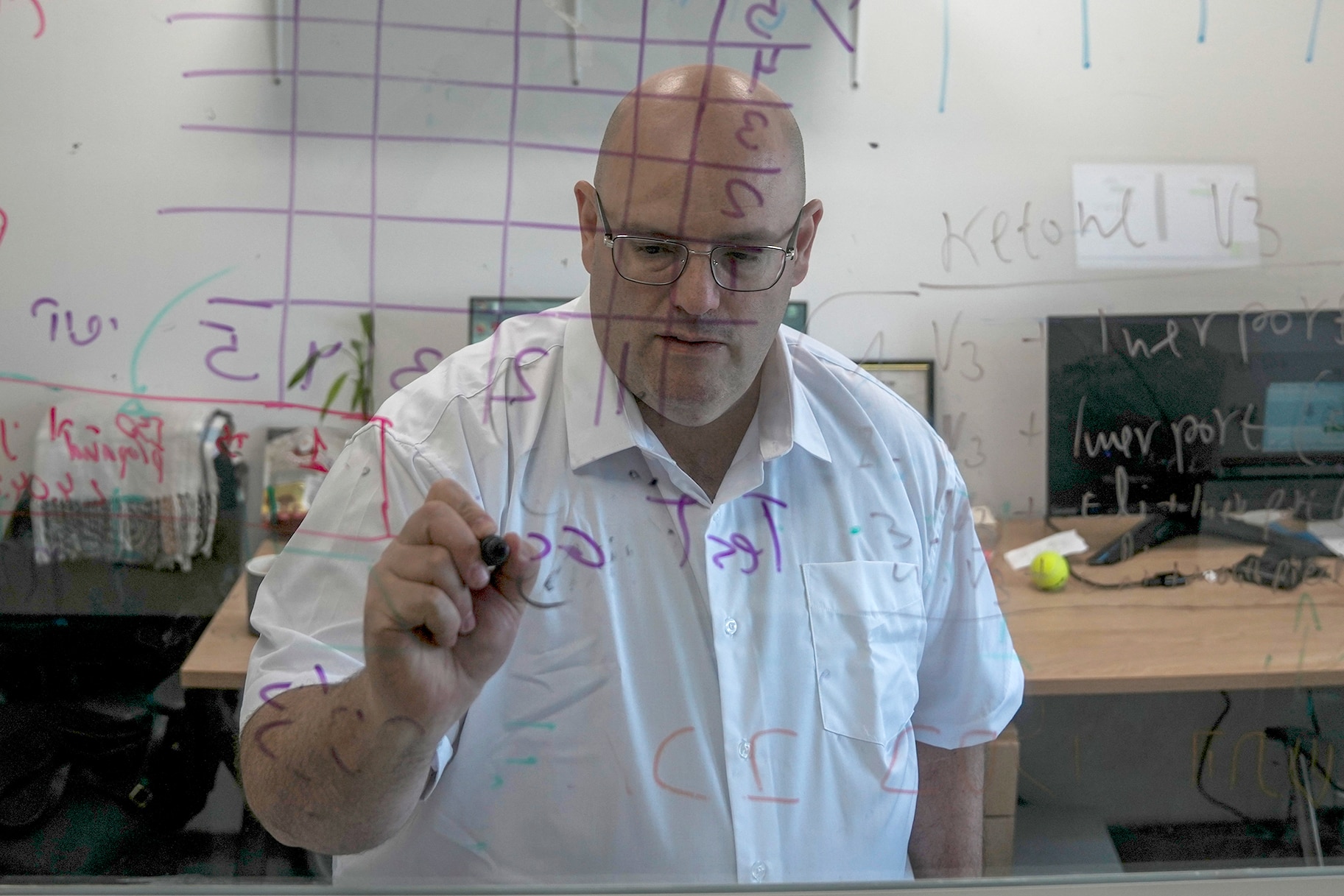 Harel Hershtik works at his lab in Israel