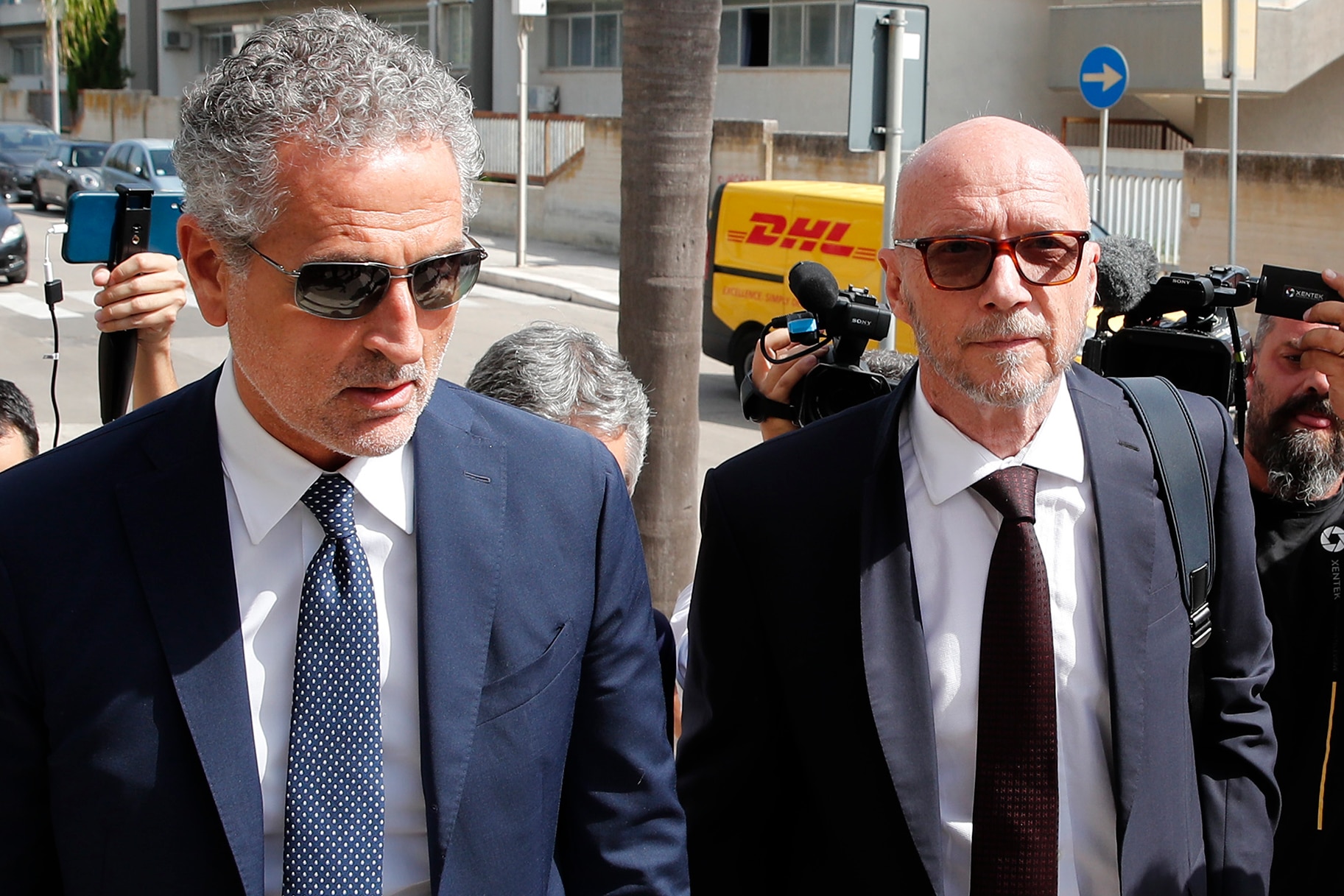 Paul Haggis arrives with his lawyer at Brindisi law court in southern Italy