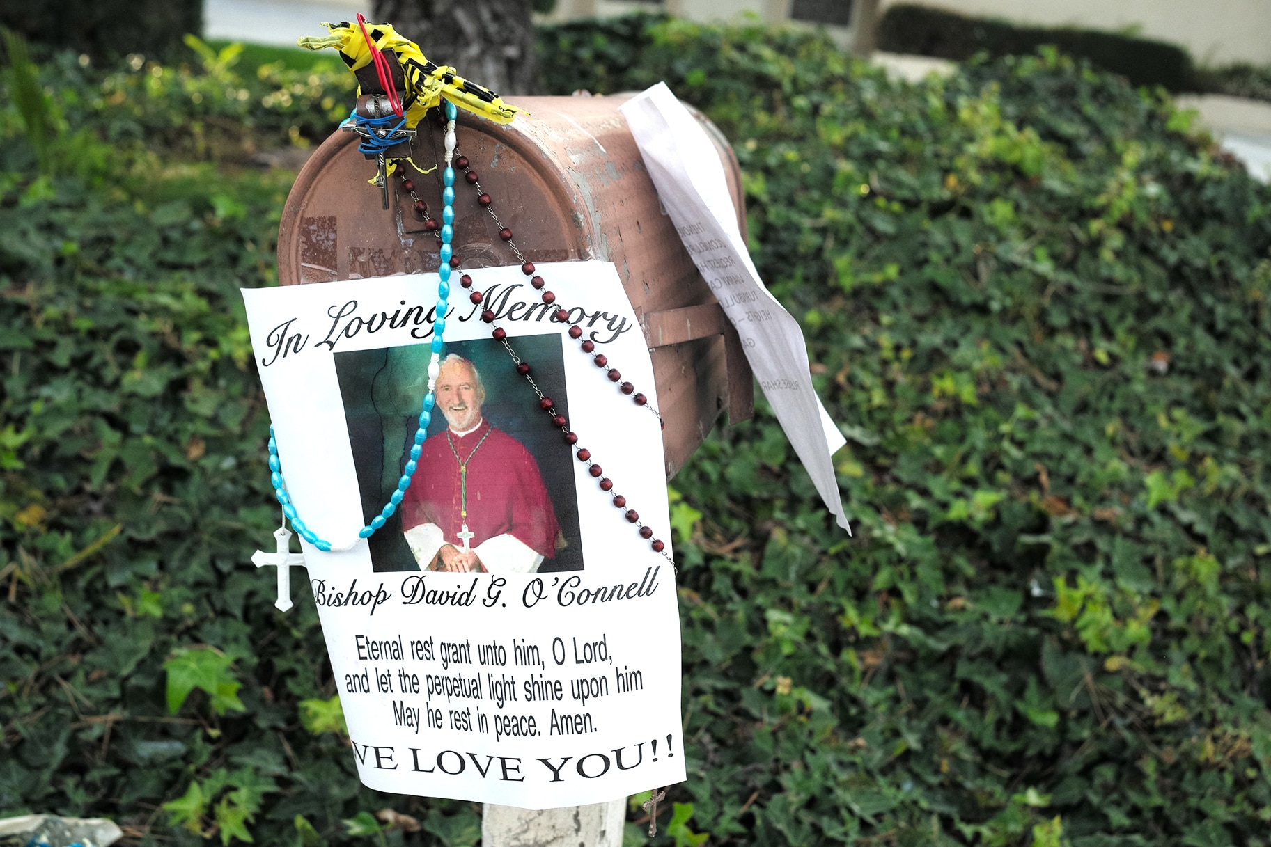 a makeshift memorial for Bishop David G. O'Connell