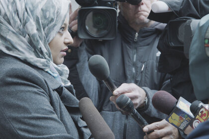 Rabia Chaudry shown talking to reporters.