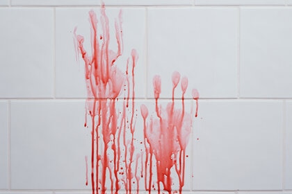 Bloody Handprints on tile wall