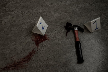 A bloody hammer at a crime scene
