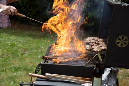 Food burning on a barbecue in summertime