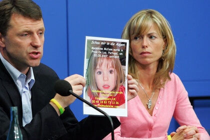 Kate and Gerry McCann, parents of missing 4-year-old British girl Madeleine McCann holding up a picture of their daughter during a press conference.