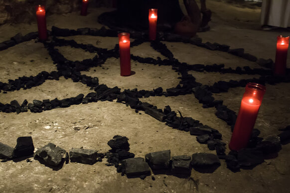 A pentagram with candles