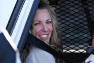 Lori Vallow Daybell sits in a police car.