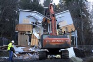 The house of murdered University of Idaho students is demolished by a bulldozer.