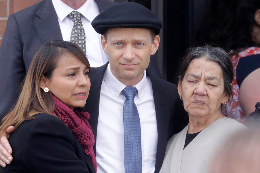 Colin Haynie, center, following the funeral for his wife Consuelo Alejandra Haynie