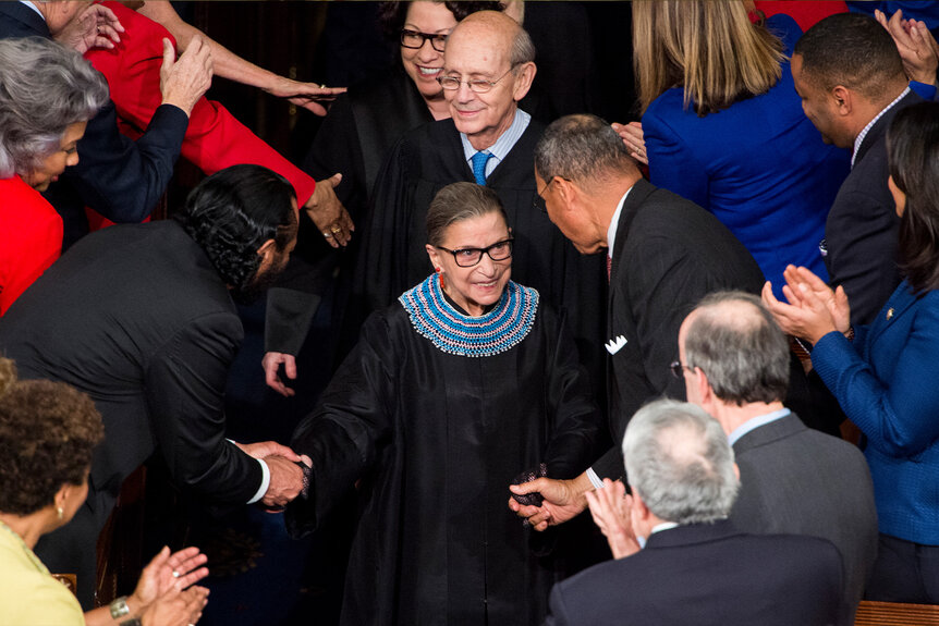 Ruth Bader Ga Supreme Court Justice Ruth Bader Ginsburg surrounded by applaudinng professionals