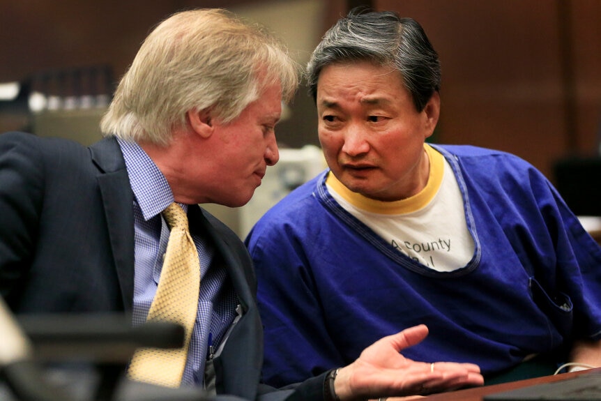 Robin Kyu Cho (right) with his attorney Seymour Amster(left)