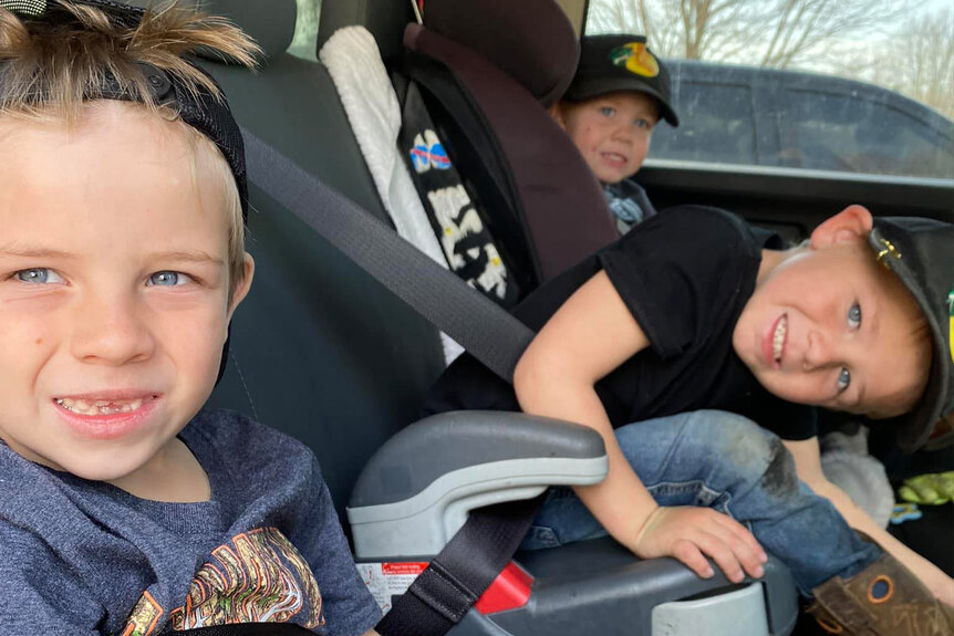 Chad Doerman's three sons in car seats
