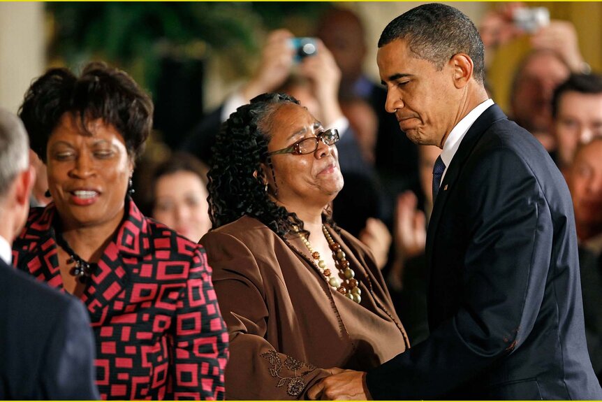 U.S. President Barack Obama greets Betty Byrd Boatner and Louvon Harris, sisters of James Byrd, Jr.