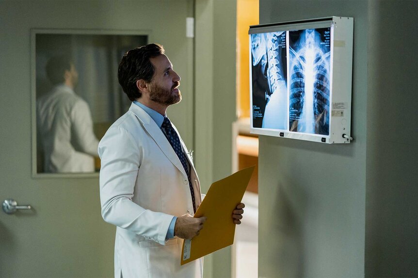 Dr Paolo Macchiarini looking at x-rays in Dr. Death Season 2