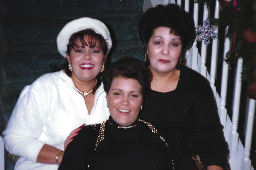 (L-R) Yvonne Palmer, Yvette Menendez, and victim Manuela "Manny" Silverio pose on stairs.