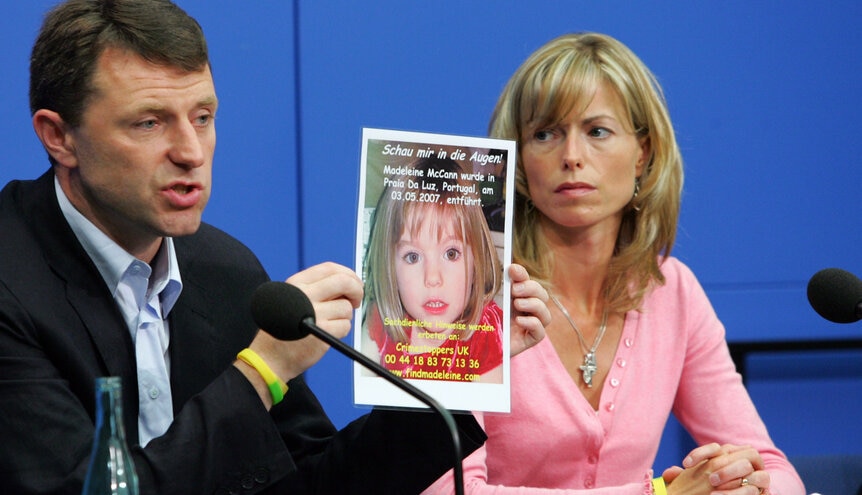 Kate and Gerry McCann, parents of missing 4-year-old British girl Madeleine McCann holding up a picture of their daughter during a press conference.
